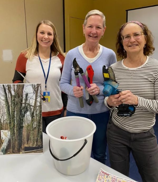 Women holding garden tools